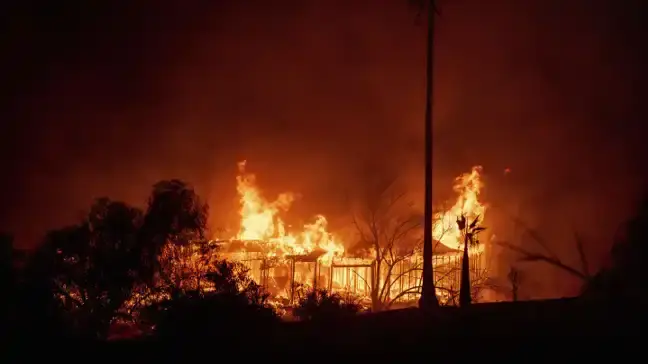 Thousands Flee as Wildfires Burn Out of Control In, Around Los Angeles