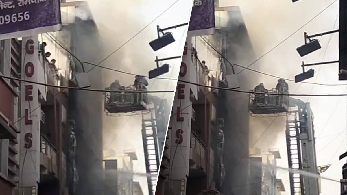 Firefighters battling a massive blaze at a residential building in Palam, Delhi with multiple fire tenders deployed.