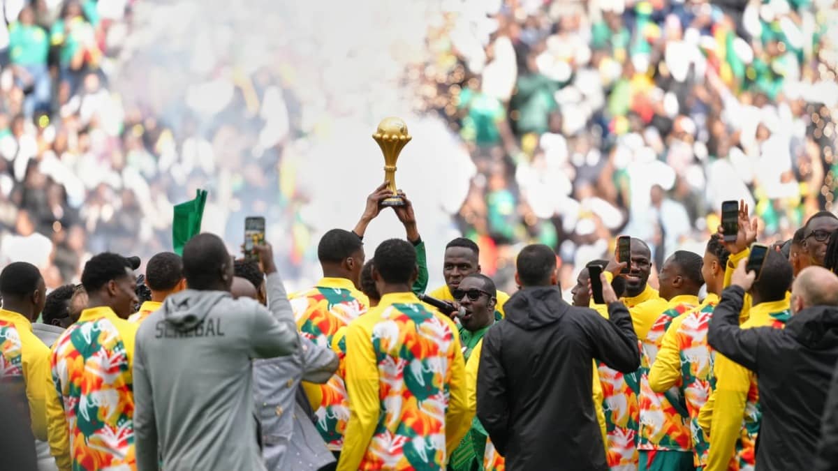 Senegal players celebrates with AFCON trophy