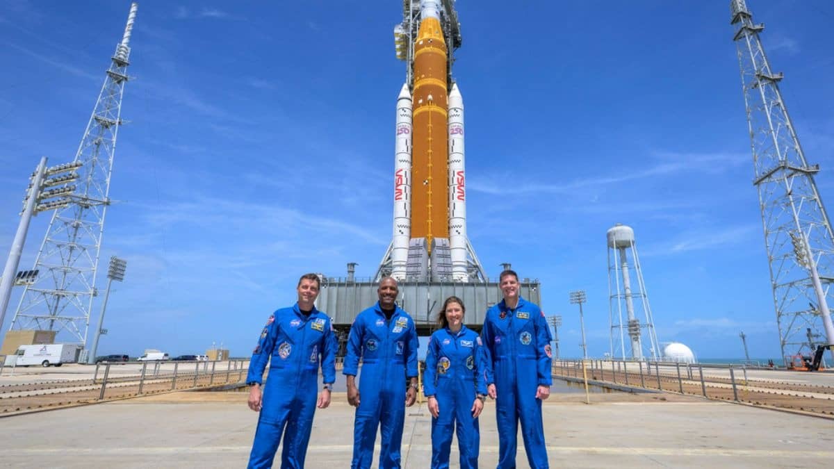 This photo provided by NASA shows NASA astronauts Reid Wiseman, Artemis II commander, from left, Victor Glover, Artemis II pilot, Christina Koch, Artemis II mission specialist, and CSA (Canadian Space Agency) astronaut Jeremy Hansen, Artemis II mission specialist, right, in a group photograph as they visit NASA's Artemis II SLS (Space Launch System) rocket and Orion spacecraft, Monday, March 30, 2026, at Launch Complex 39B of NASA's Kennedy Space Center, in Cape Canaveral, Fla.