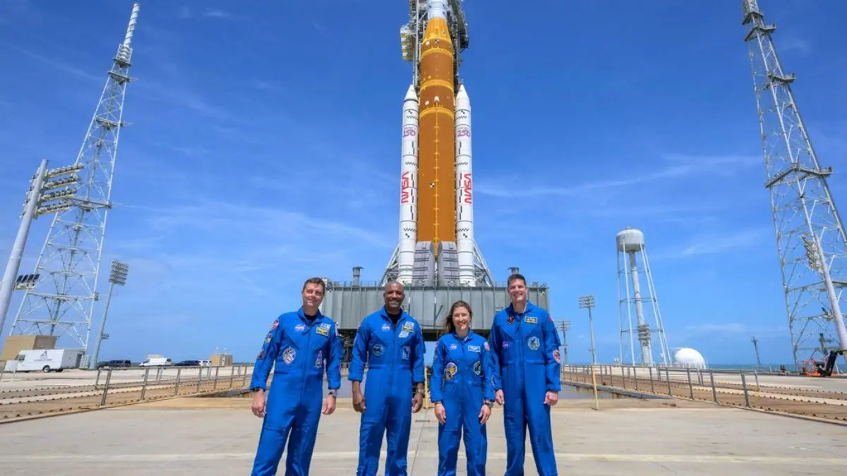NASA Artemis II Launch: Liftoff To Splashdown, All Your Questions Answered This photo provided by NASA shows NASA astronauts Reid Wiseman, Artemis II commander, from left, Victor Glover, Artemis II pilot, Christina Koch, Artemis II mission specialist, and CSA (Canadian Space Agency) astronaut Jeremy Hansen, Artemis II mission specialist, right, in a group photograph as they visit NASA's Artemis II SLS (Space Launch System) rocket and Orion spacecraft, Monday, March 30, 2026, at Launch Complex 39B of NASA's Kennedy Space Center, in Cape Canaveral, Fla.