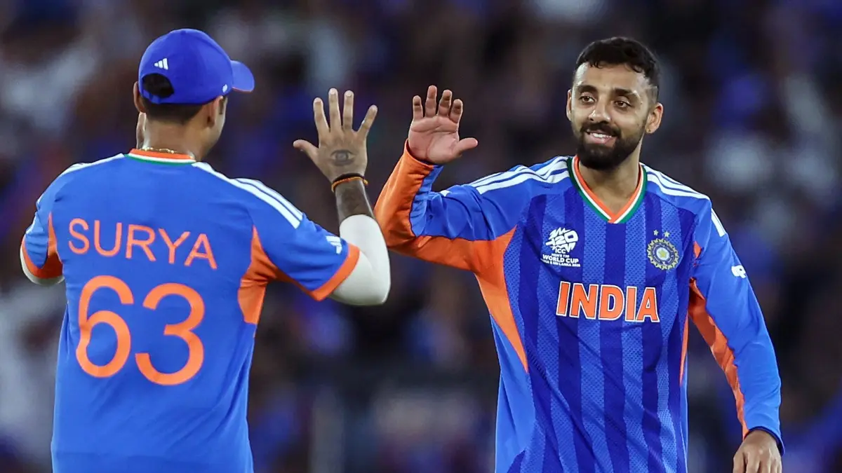 'Life Has Come A Full Circle': Varun Chakaravarthy Hails Historic T20 World Cup Title Triumph Varun Chakaravarthy and Suryakumar yadav celebrate a wicket