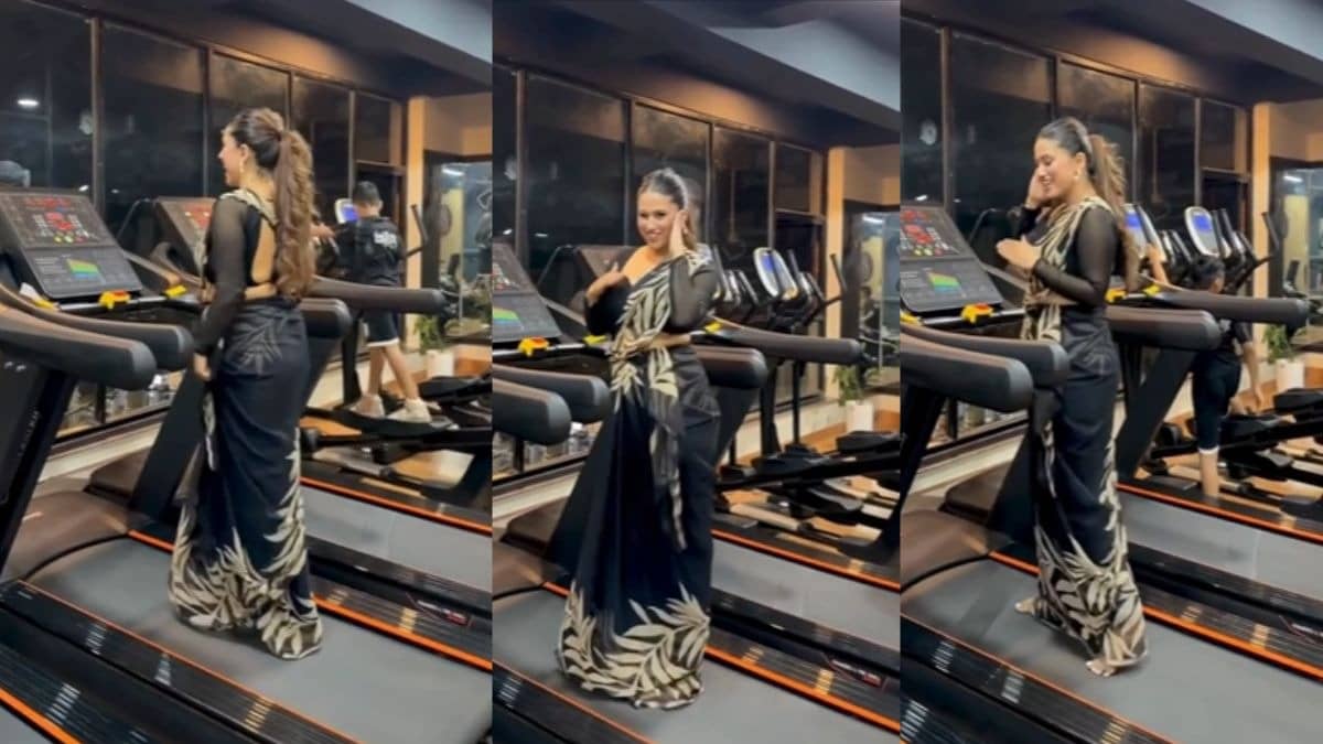 women in black saree reach gym