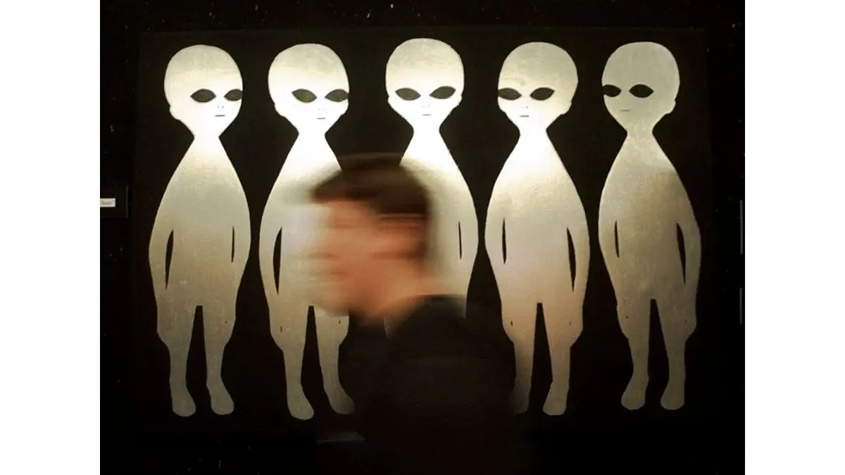 As Trump Orders UFO Data Released, A Question Hangs: If Aliens Exist, What Would They Think Of Us? A patron passes a painting inside the International UFO Museum and Research Center in Roswell, N.M., on June 10, 1997.