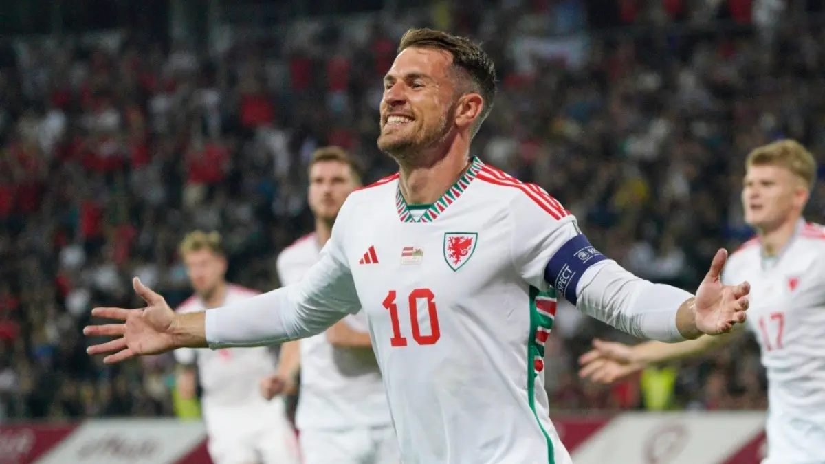 Former Wales and Arsenal midfielder Aaron Ramsey Calls Time On Playing Career Aaron Ramsey celebrating after scoring a goal for Wales