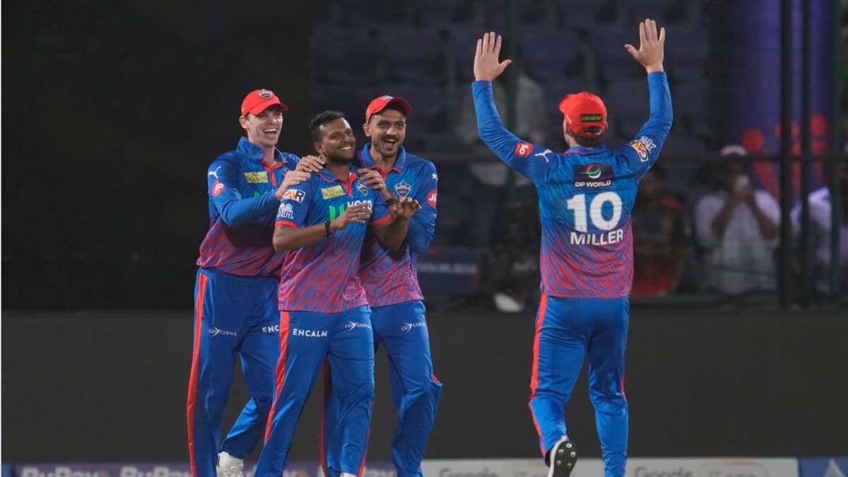 Delhi Capitals players celebrate after taking a wicket against RCB