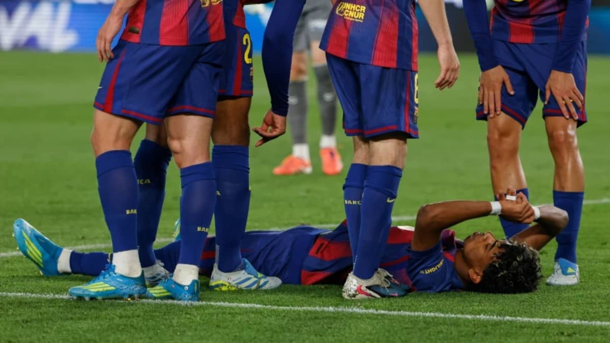 Lamine Yamal lies on the pitch in pain after sustaining injury