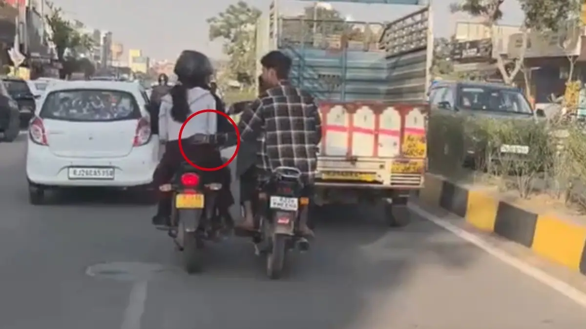 Two Men On Bike Harass Woman On Busy Jaipur Road, Video Goes Viral Two Men On Bike Harass Woman On Busy Jaipur Road, Video Goes Viral