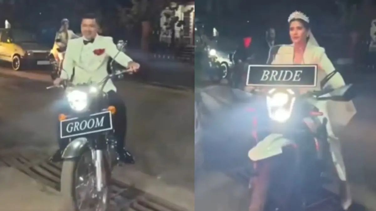 VIDEO: कार या घोड़ी नहीं, आगे-आगे दूल्हा, पीछे-पीछे दुल्हन... बाइक पर कपल ने ली अनोखी एंट्री, ट्रेंड हुआ VIRAL Viral Video