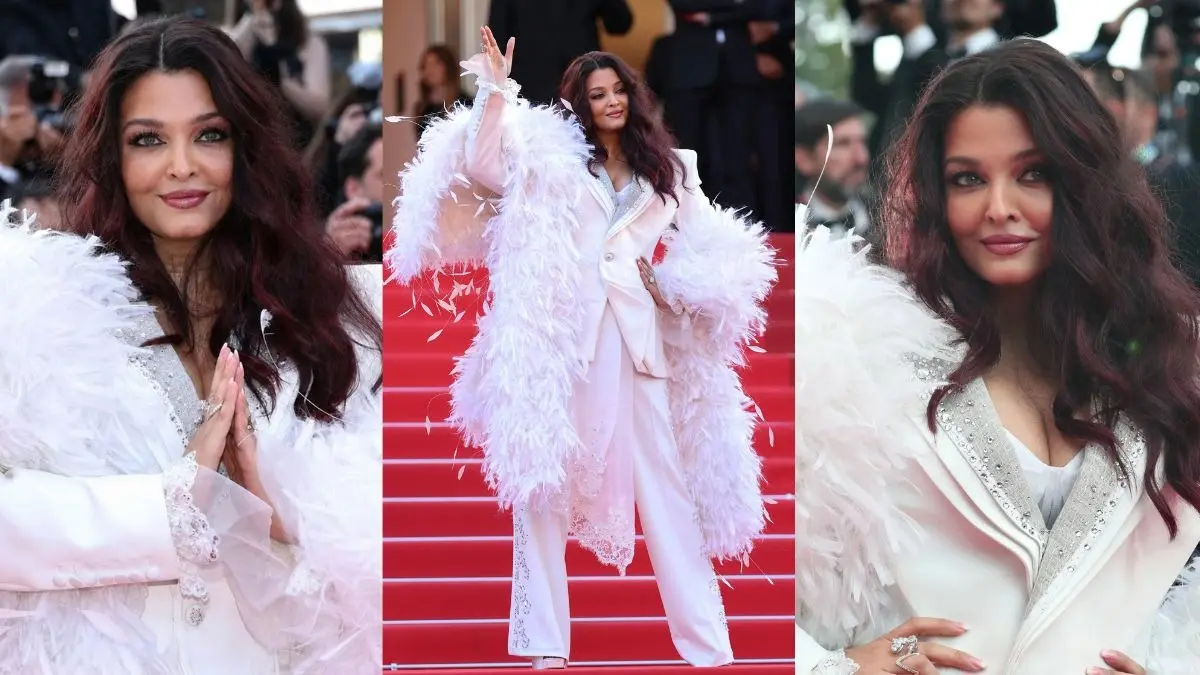 Aishwarya Rai Bachchan Cannes 2026: कान्स के समापन पर छा गईं ऐश्वर्या राय, ऑल-व्हाइट पावर सूट में दिखा अब तक का सबसे अनोखा अंदाज; फेदर बोआ लुक वायरल Aishwarya Rai Bachchan Cannes 2026