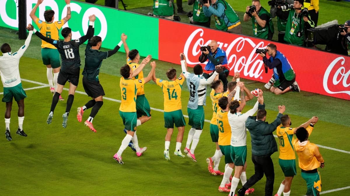 Australian players celebrate after Paraguay draw