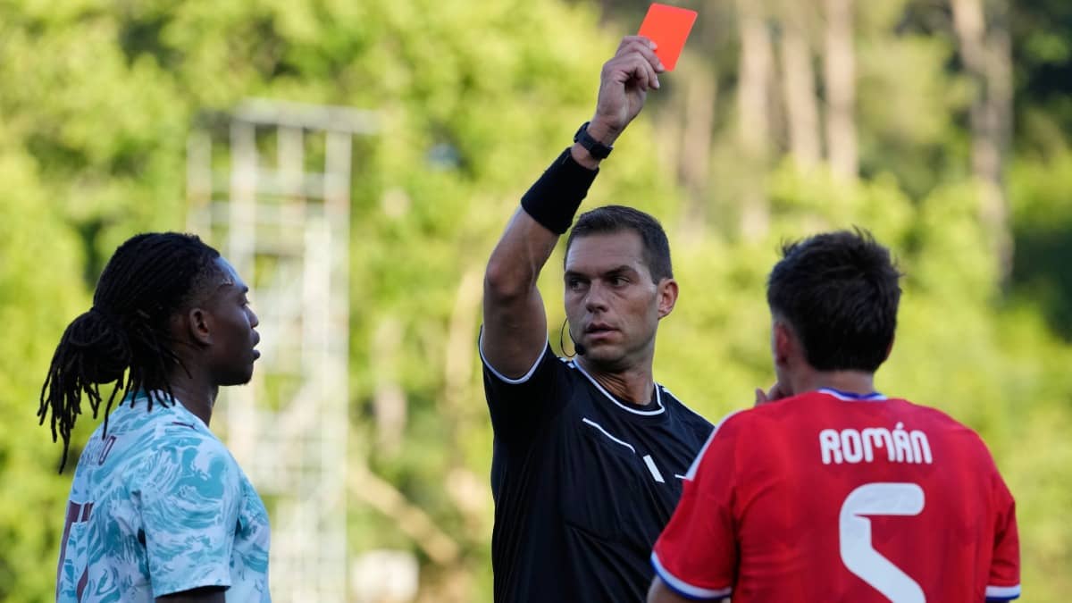 Portugal's Rafael Leao is shown a red card