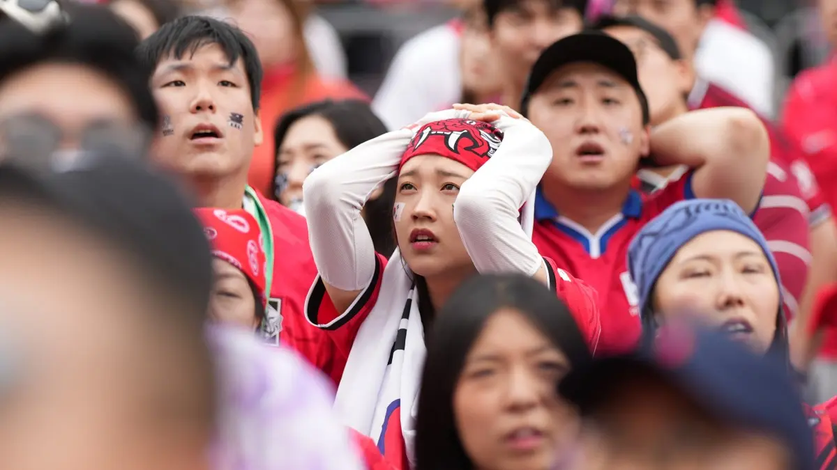 Security Heightened At Incheon Airport After South Korea's Early FIFA World Cup Exit Ignites Fury and Death Threats South Korean fans react during a FIFA World Cup match