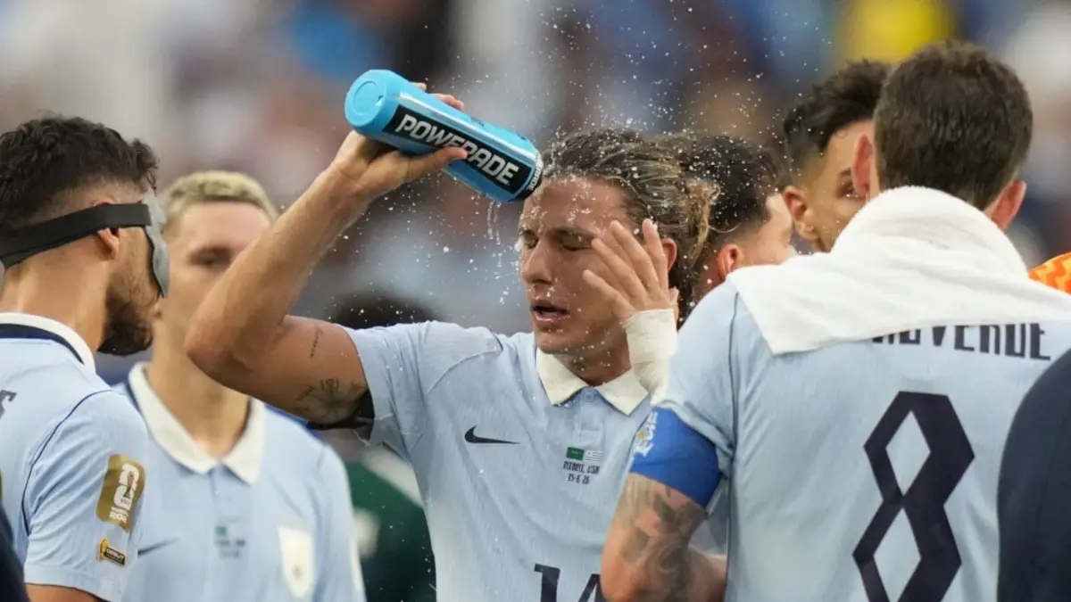 FIFA Hydration Breaks Spark Backlash, Blamed For Killing Momentum At World Cup 2026 Uruguay’s Agustin Canobbio cools off during a hydration break in the FIFA World Cup 2026
