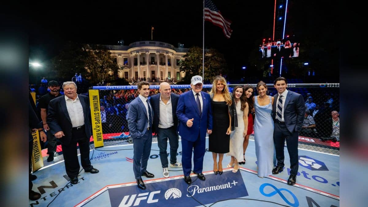 US President Donald Trump, first lady Melania Trump, UFC President and CEO Dana White and other guests pose inside the octagon after UFC Freedom 250 on the South Lawn of the White House, Monday, June 15, 2026, in Washington.