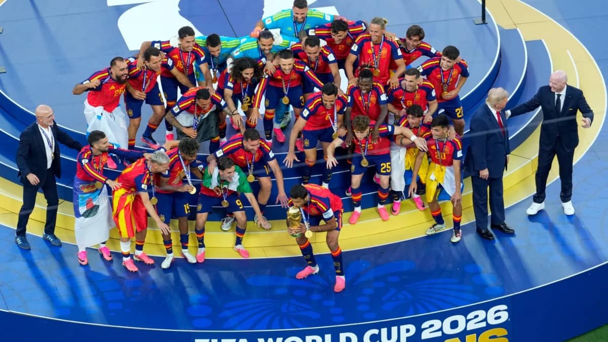 Donald Trump with the victorious Spain team