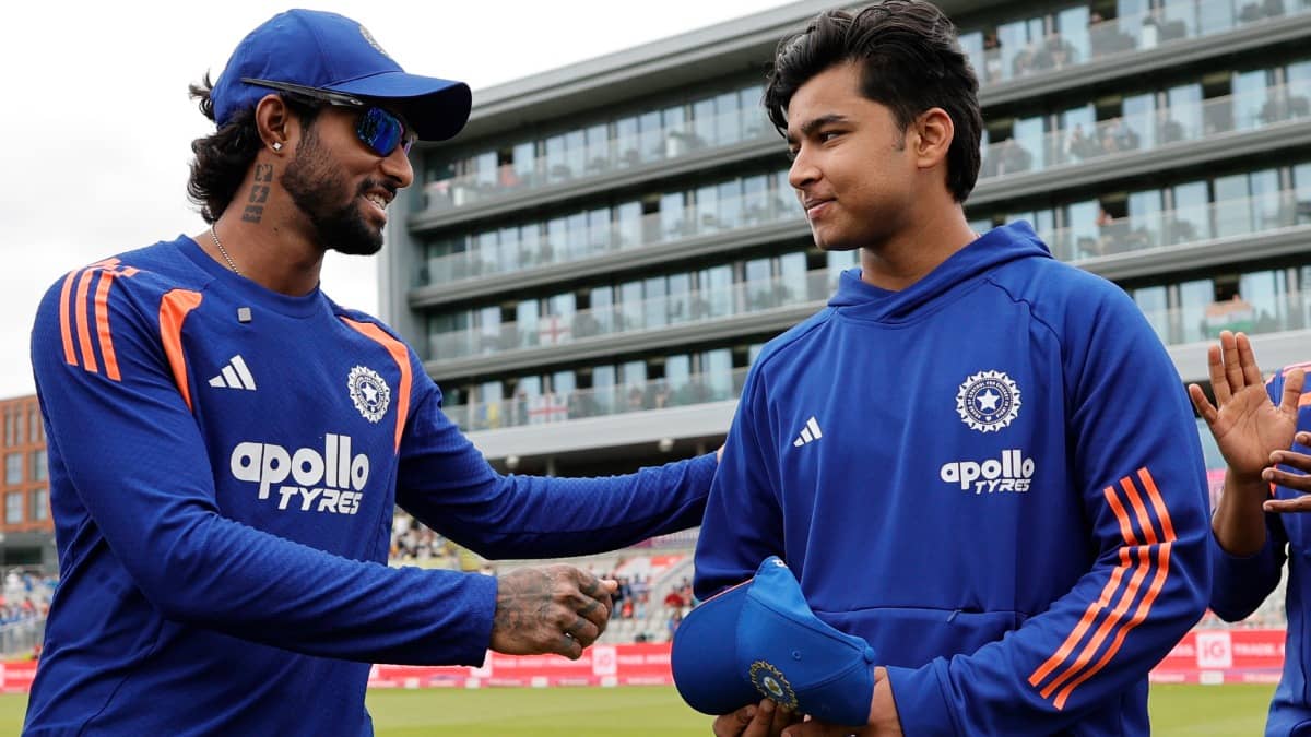 Vaibhav Sooryavanshi receiving maiden India cap from Tilak Varma
