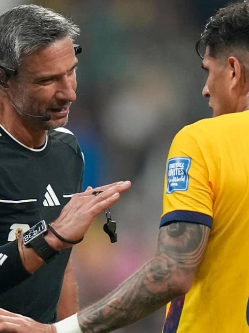 Piero Hincapie in conversation with referee