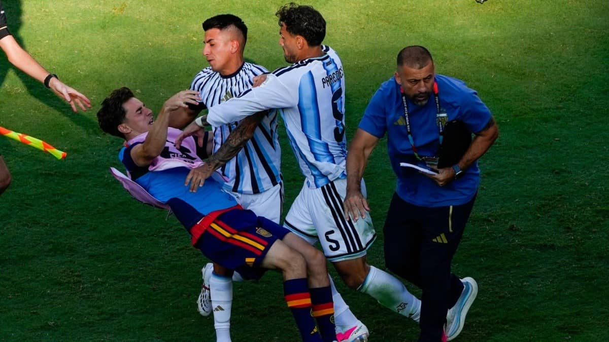 Spain's Gavi falls as he scuffles with Argentina's Leandro Paredes and Thiago Almada after the end of FIFA World Cup 2026 final
