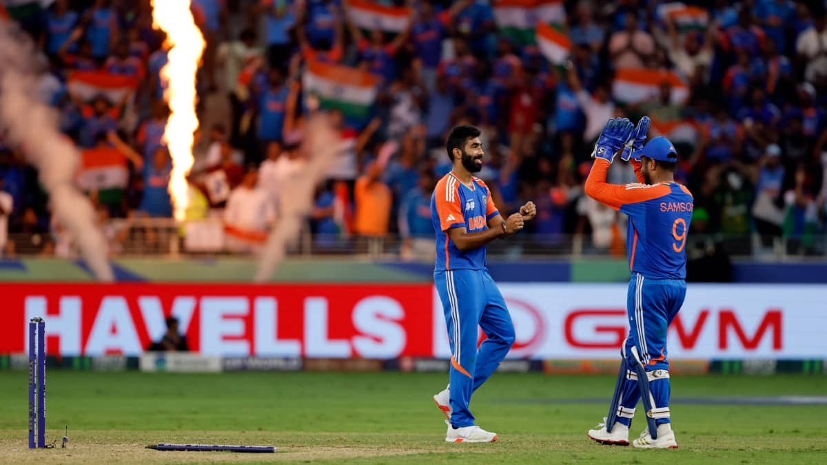 Jasprit Bumrah celebrates a wicket with Sanju Samson