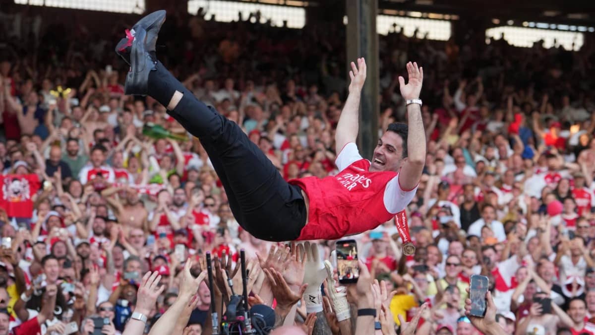 Mikel Arteta is thrown in the air