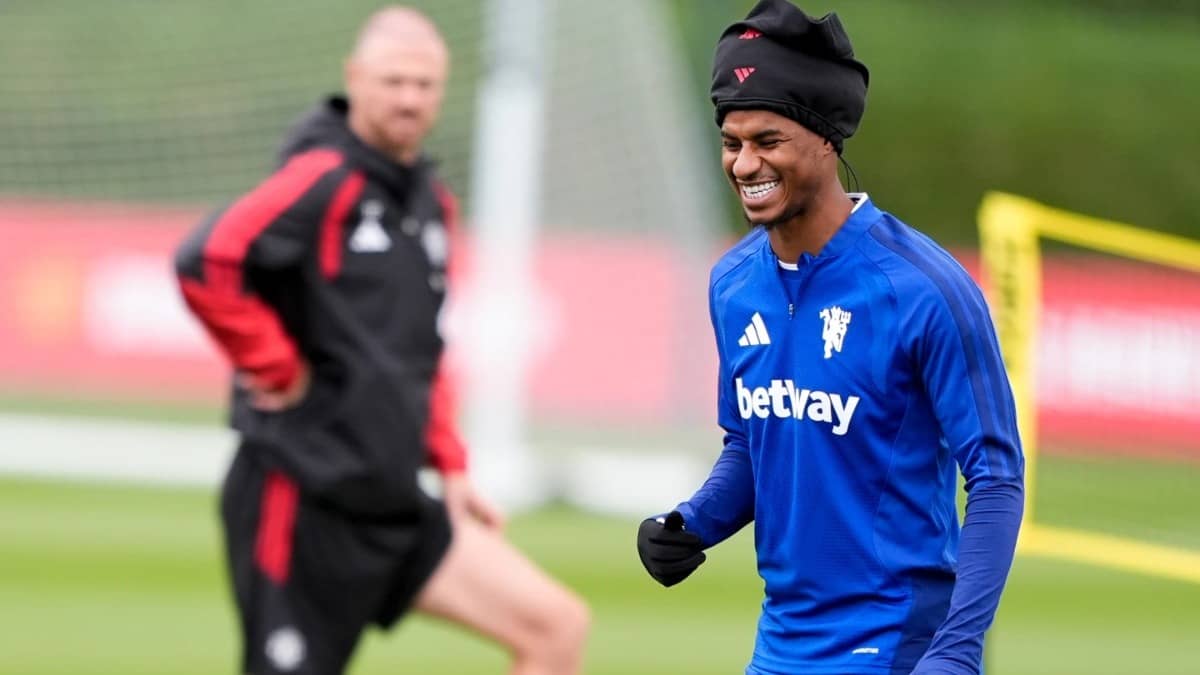 Marcus Rashford smiles at a practice session