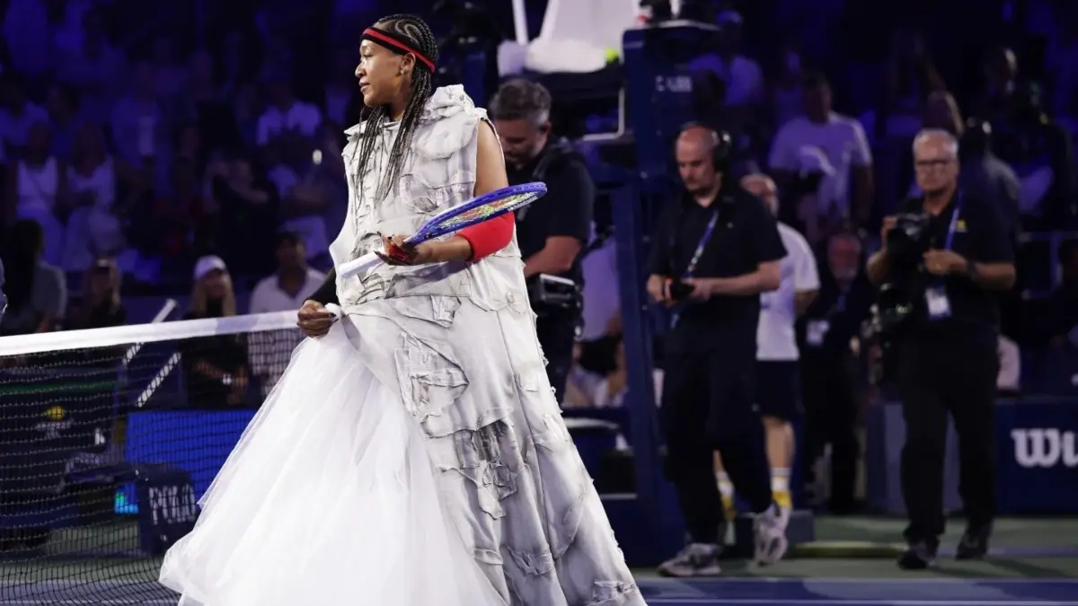 Hoodies and Cornrows: Breaking Down Naomi Osaka’s Allen Iverson Inspired US Open Entrance Naomi Osaka’s Allen Iverson Inspired US Open Entrance