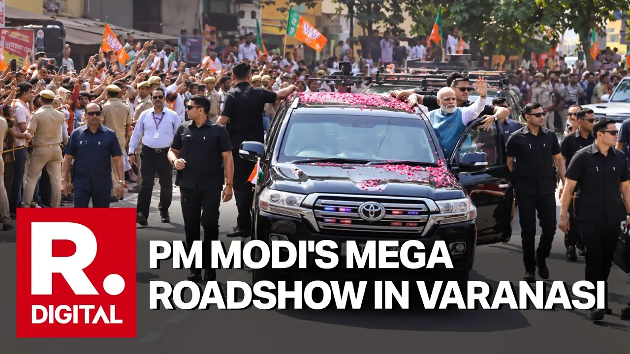 PM Modi Holds Mega Roadshow in Varanasi; Receives Rousing Welcome Amid Chants of 'Har Har Mahadev' PM Modi Holds Mega Roadshow in Varanasi Amid Chants of 'Har Har Mahadev'