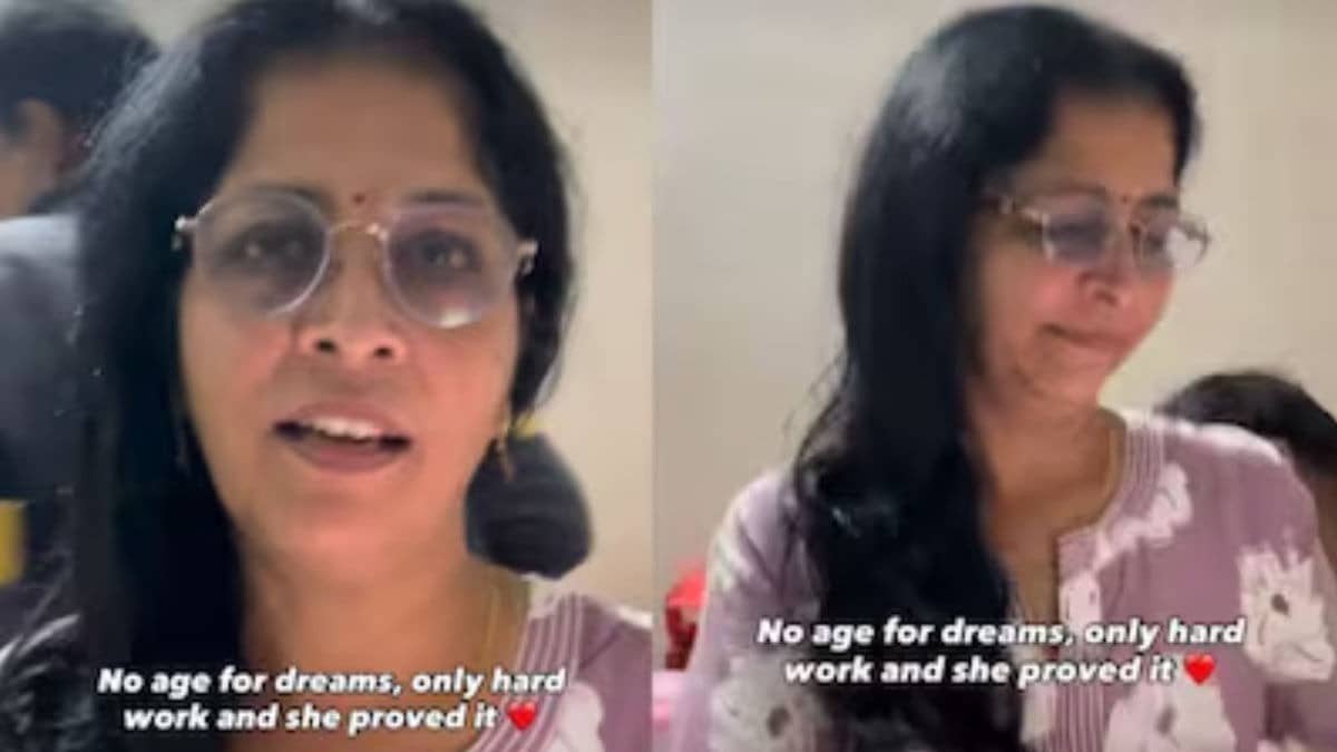 52-year-old woman proudly holding her first YouTube income with daughter