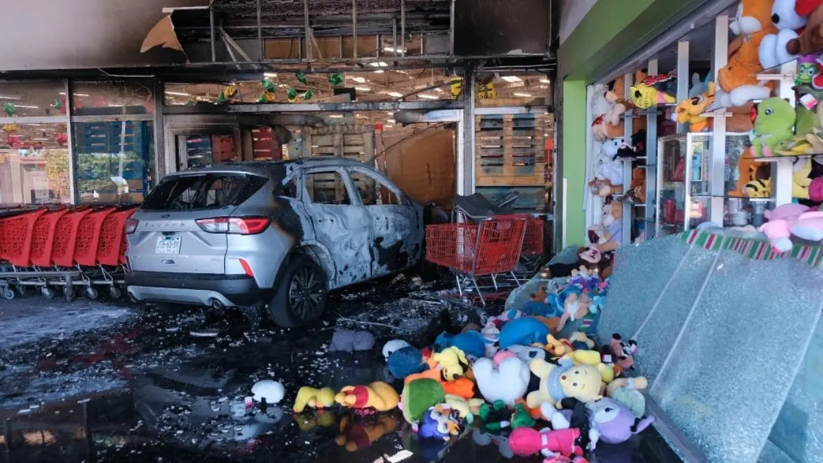 Football Matches Postponed Amid Violence After Army Kills Mexican Cartel Leader ‘El Mencho’ A charred vehicle at the damaged supermarket in Guadalajara