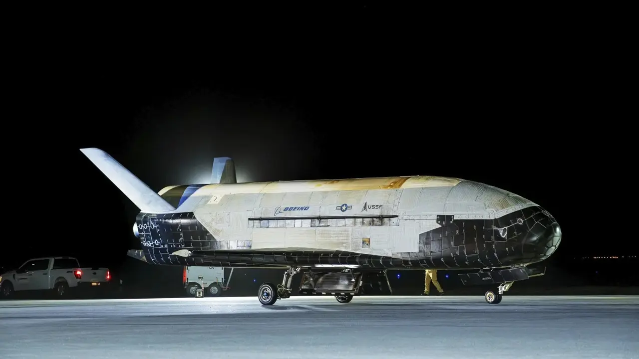 A classified US military spaceplane named X-37B has returned to Earth after spending 434 days in orbit on a mysterious mission.