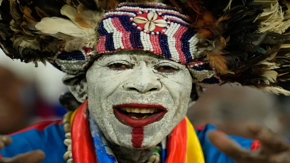 A DR Congo fan cheers for his team at AFCON