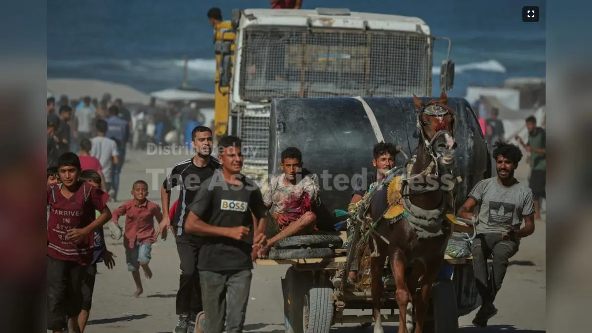 ‘All Those Who Stay Back Will Be Considered Militants’: Israel Orders Palestinians To Leave Gaza City A Palestinian man injured by Israeli artillery fire targeting a group of civilians fleeing from northern Gaza to the south is evacuated on a horse-drawn cart, in central Gaza.