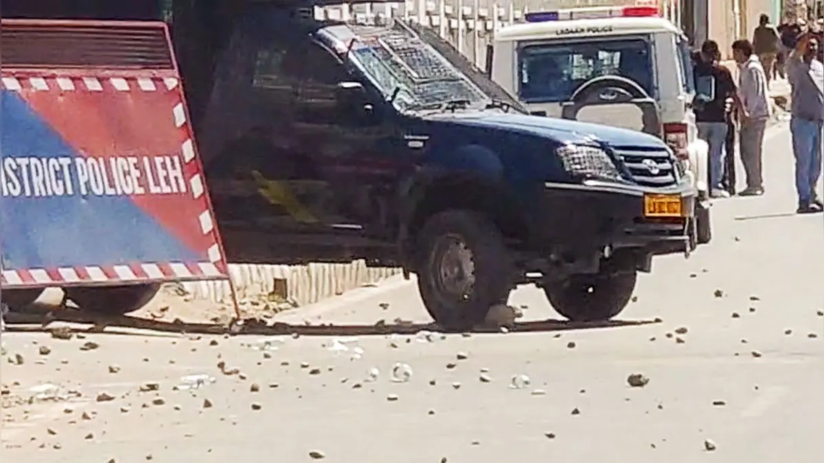 A police van with stones lying on the street seen during a massive protest over the statehood demand and the inclusion of Ladakh under the Sixth Schedule, in Leh on Wednesday.