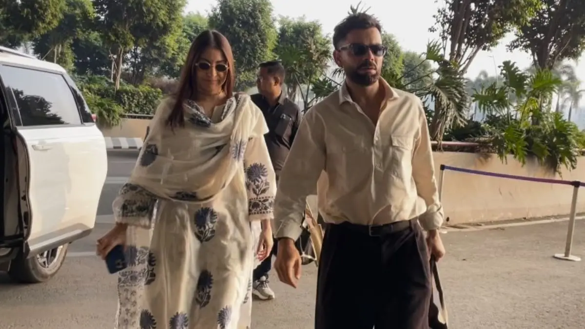 Watch: Anushka Sharma-Virat Kohli Twin In White As They Jet Off Together From Mumbai Anushka Sharma and Virat Kohli at airport