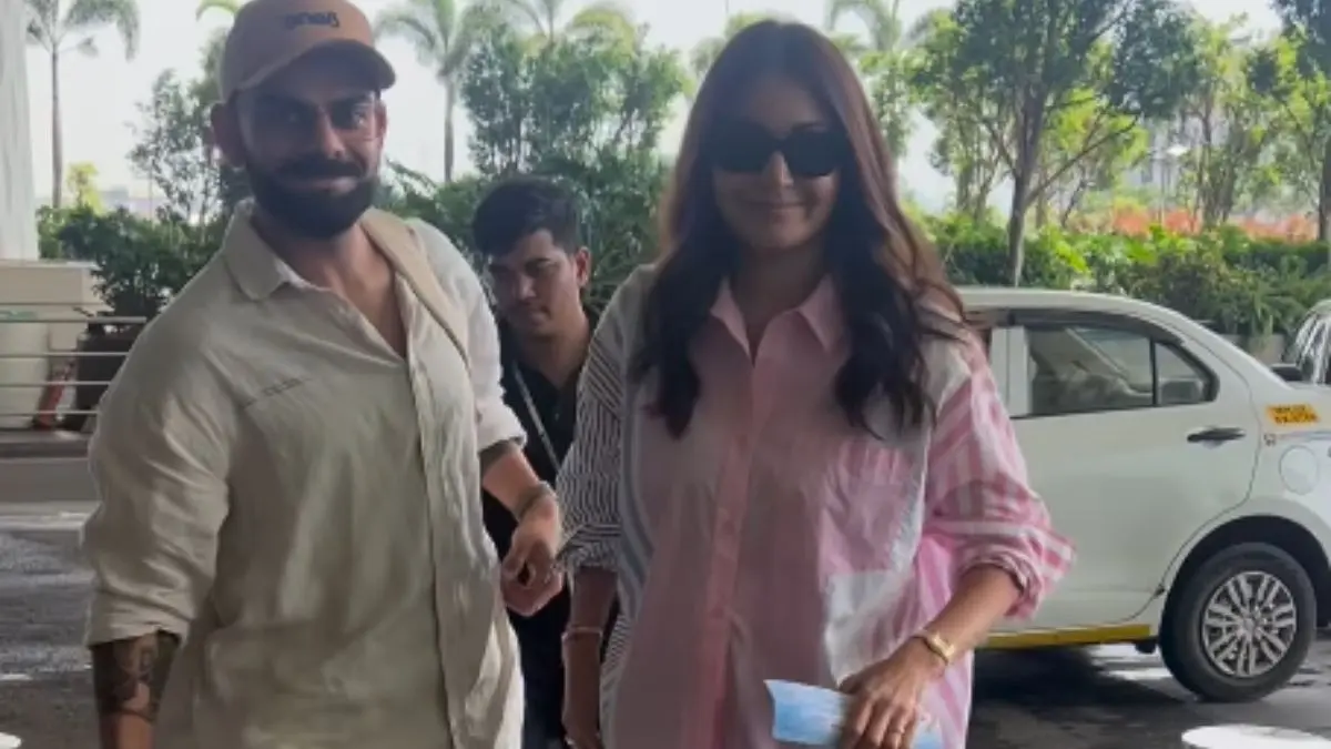 Anushka Sharma Forces A Smile On Being Snapped At Airport