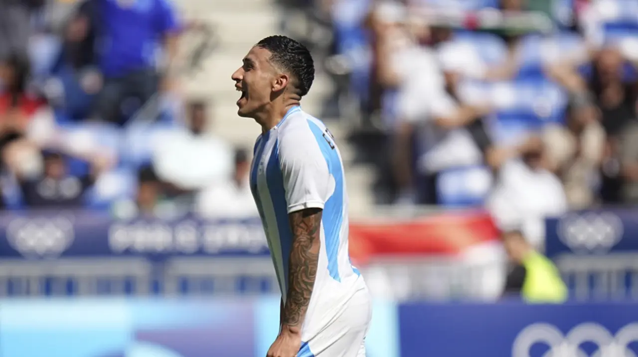 Argentina shakes off chaos of Morocco game by beating Iraq 3-1. Spain reaches Olympic quarterfinals