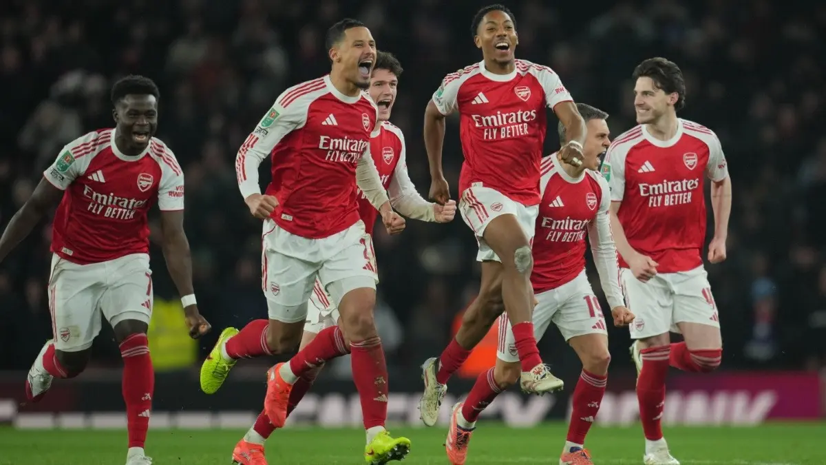 Arsenal players celebrate after winning in a penalty shootout in the League Cup quarter-final fixture against Crystal Palace