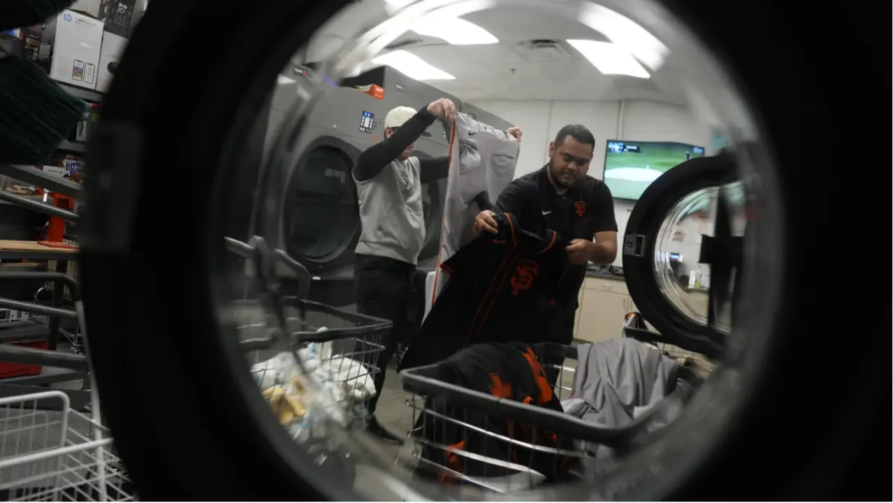 Six Laundry Secrets From The Baseball Pros — The Clubhouse Staffers Who Wash MLB Uniforms Arturo Maya, right, and Riley Halpin, left, inspect and sort laundry in the San Francisco Giants laundry room during spring training baseball practice at the team’s facility, Monday, Feb. 17, 2025, in Scottsdale, Ariz.