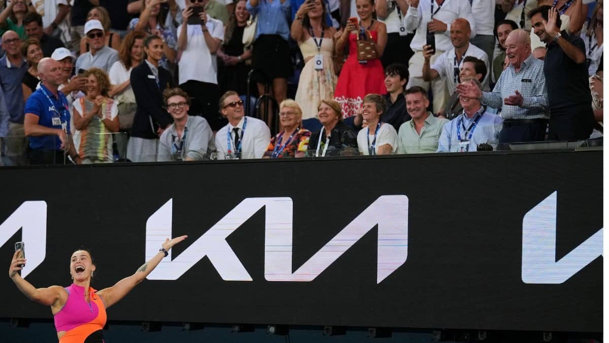 Aryna Sabalenka taking a selfie with  Roger Federer and Rod Laver