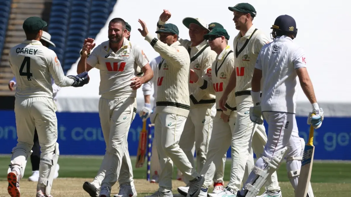Australia's Michael Neser, third left, celebrates with teammates after taking the wicket of England's Joe Root in the Melbourne Test