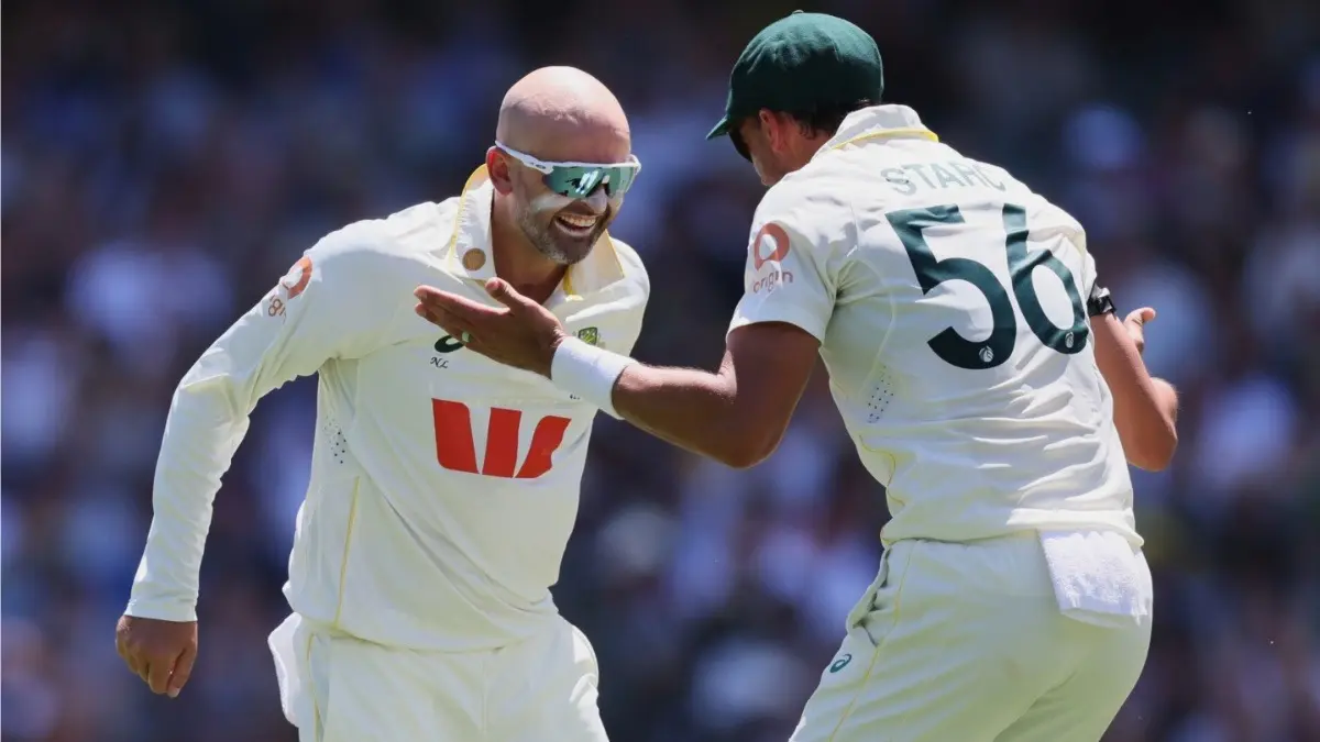Nathan Lyon Opens Up On Breaking Glenn McGrath's Elusive Milestone In Test For Australia: 'Pretty Humbling' Australia's Nathan Lyon, left, celebrates with teammate Mitchell Starc after dismissing England's Ben Duckett during the Adelaide Test