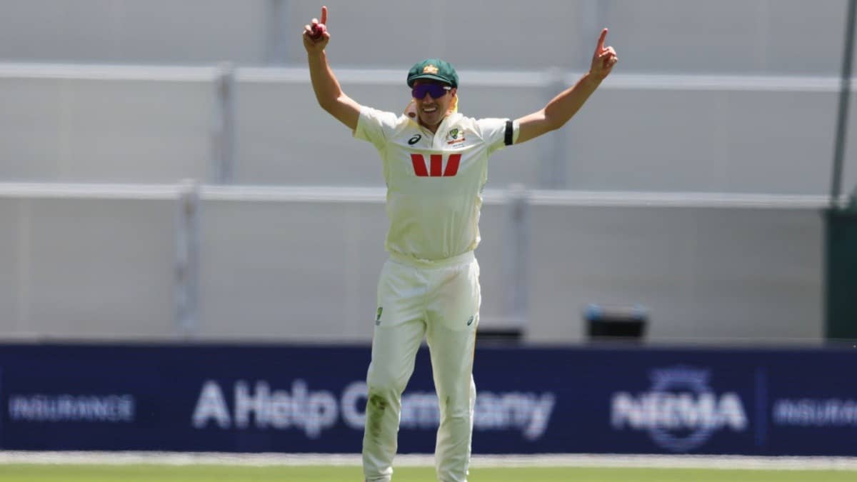 Australia's Pat Cummins reacts after taking a catch to dismiss England's Jamie Smith in the Adelaide Test