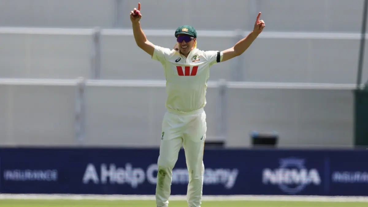 Australia's Pat Cummins reacts after taking a catch to dismiss England's Jamie Smith in the Adelaide Test