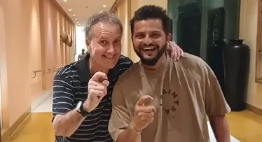 Billy Bowden and Suresh Raina