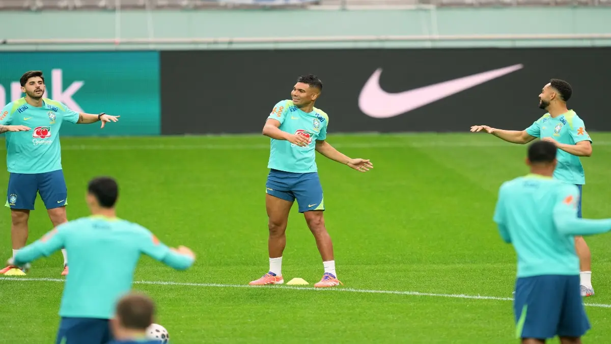 Brazil players warm up during a practice session