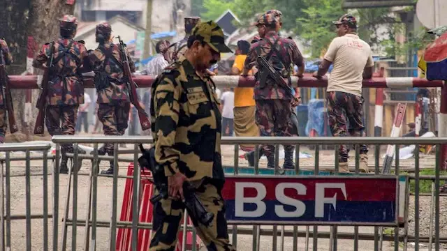 BSF personnel stands guard at the India-Bangladesh border checkpost.