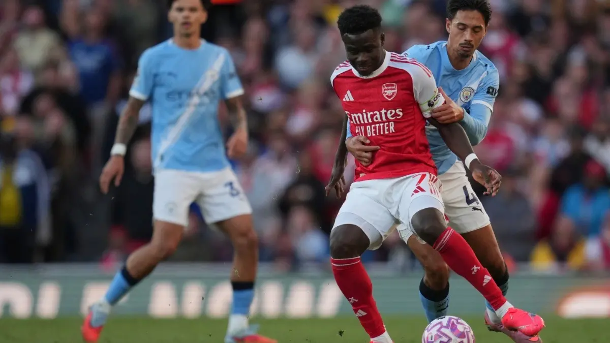 Bukayo Saka in action against Manchester City in the Premier League