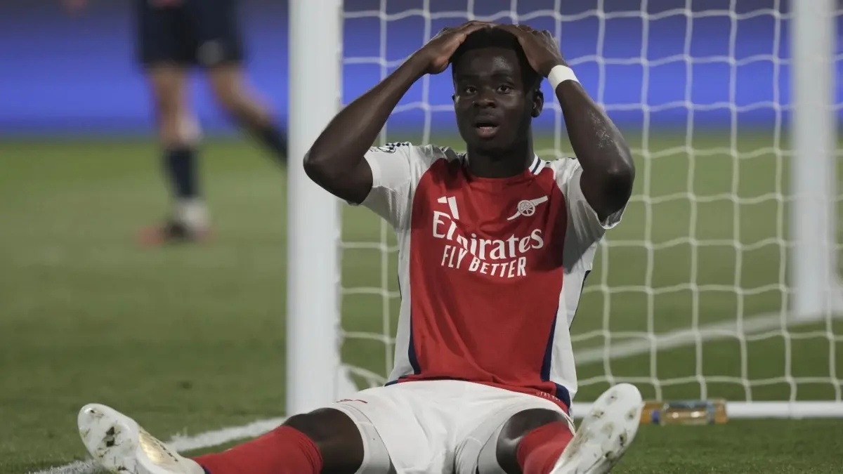 Bukayo Saka reacts after missing a goal against PSG