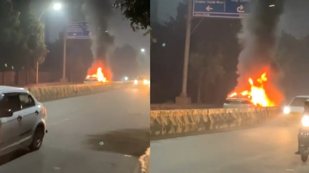 Car Bursts Into Flames On Noida Road, No Casualties Reported Car bursts into flames on Noida road, no casualties reported